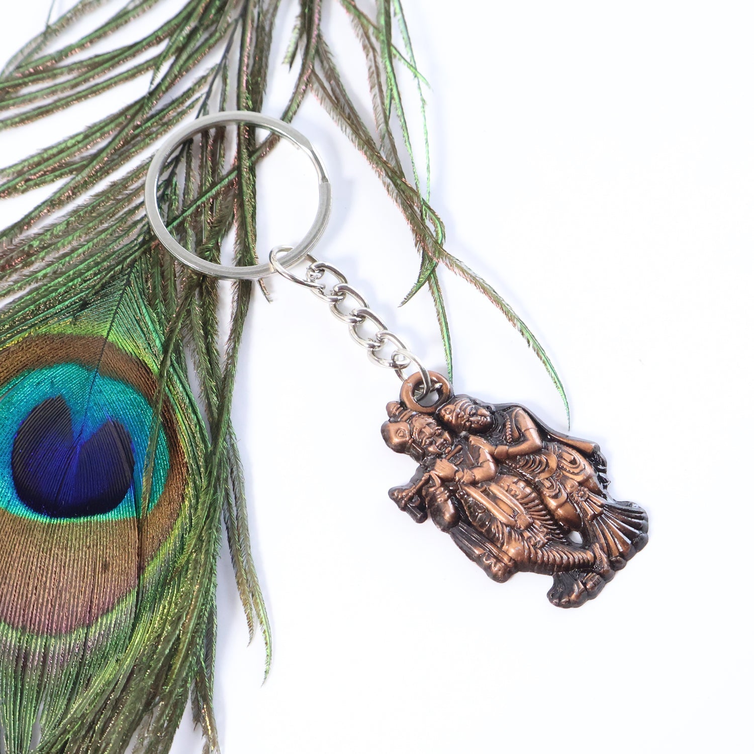Antique finished metal Radha Krishna keychain with spiritual aura