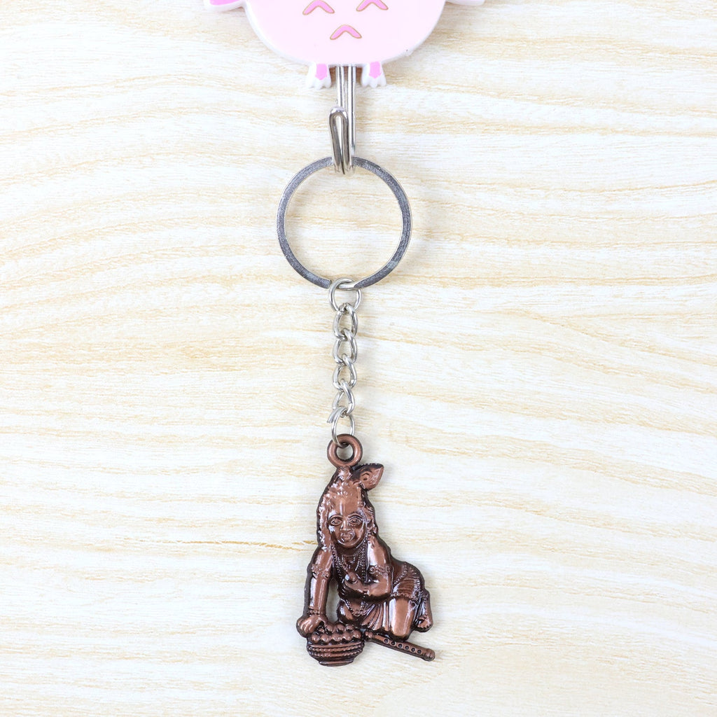 Metal Bal Krishna keychain attached to a set of keys