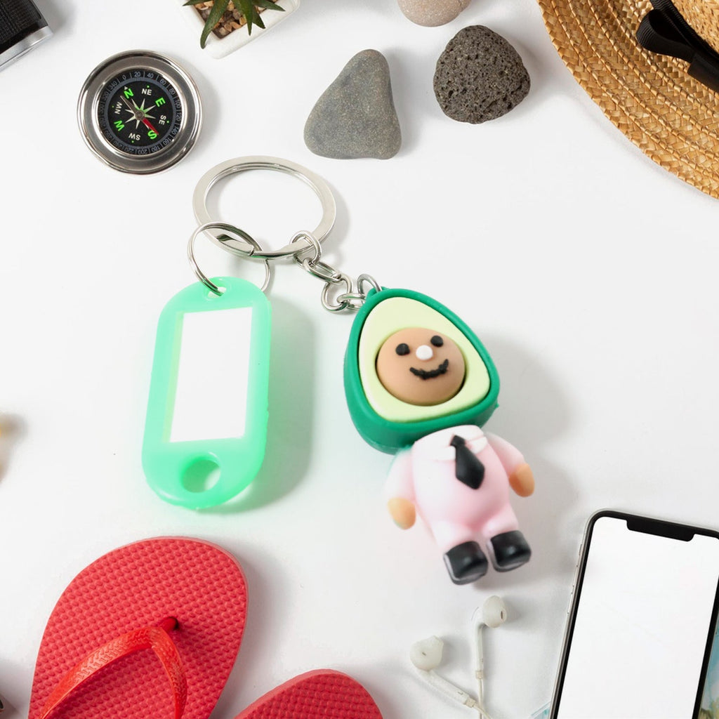Cartoon keychain accessory featuring avocado character and metal keyring