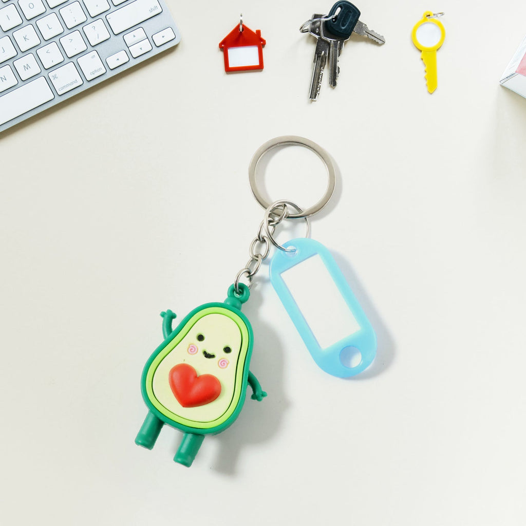 Avocado cartoon keychain accessory with heart detail for keys and backpacks