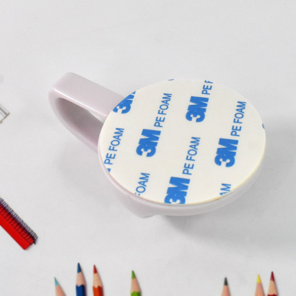 HoldStrong self-adhesive wall hook showing strong adhesive backing.