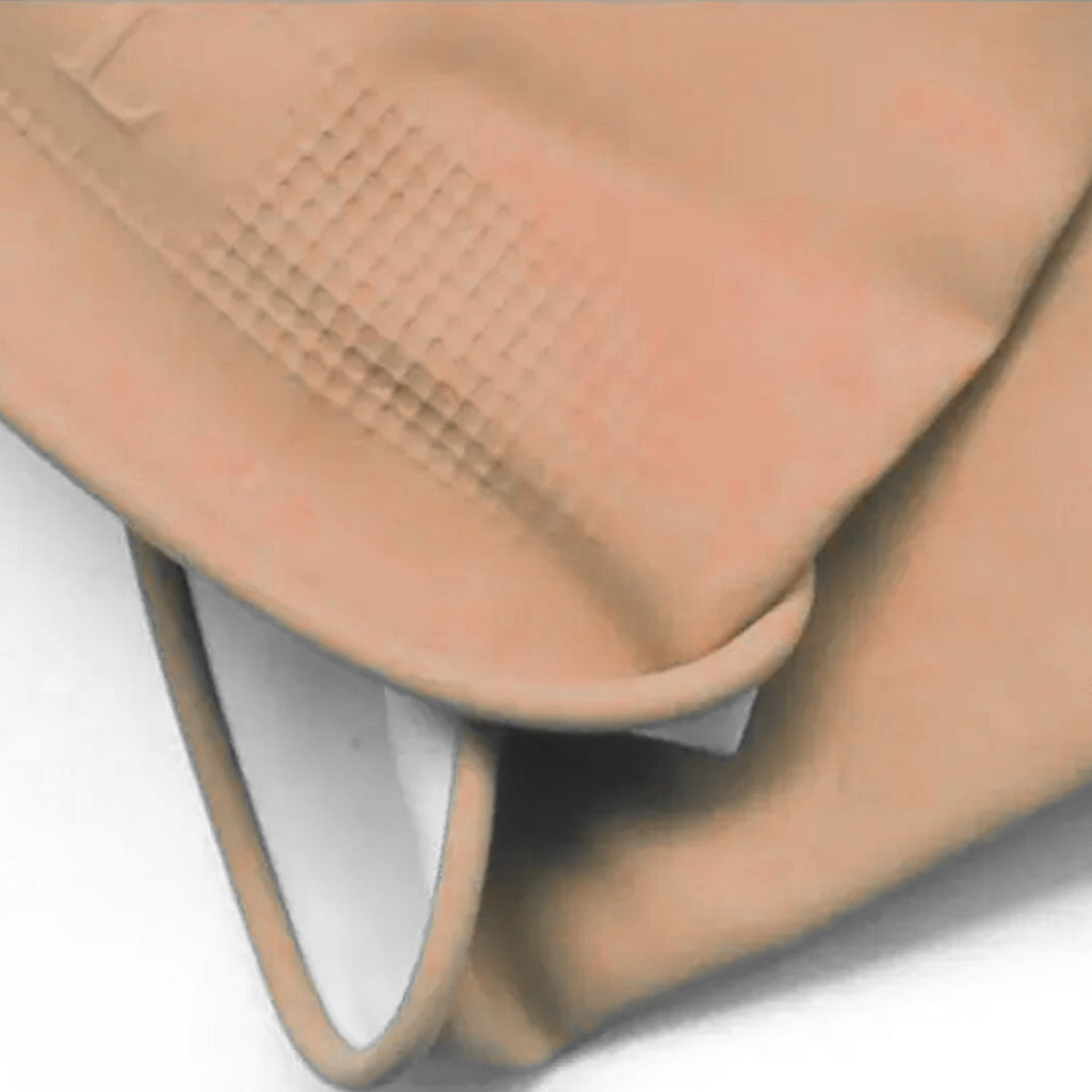 Hands wearing natural gum rubber cleaning gloves tackling tough stains.
