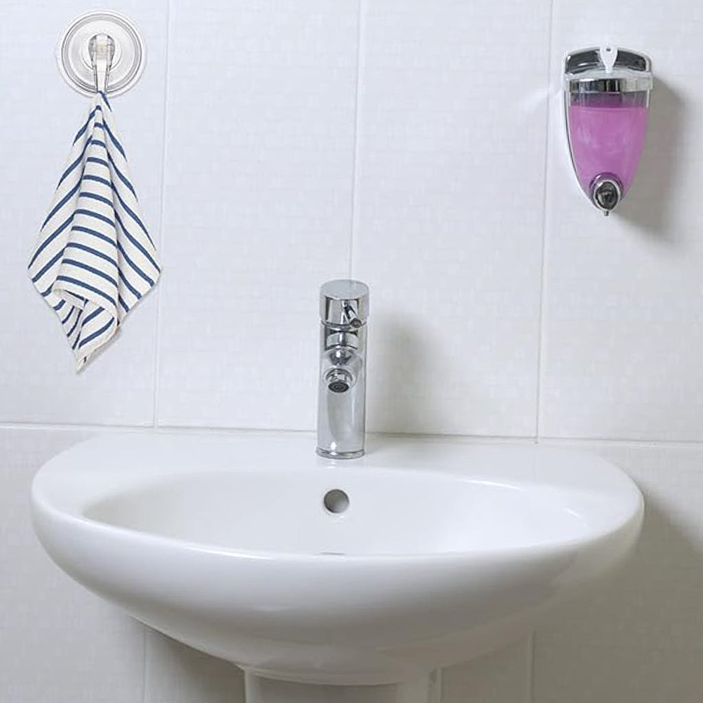 Clear plastic suction cup hook holding decorative hanging items