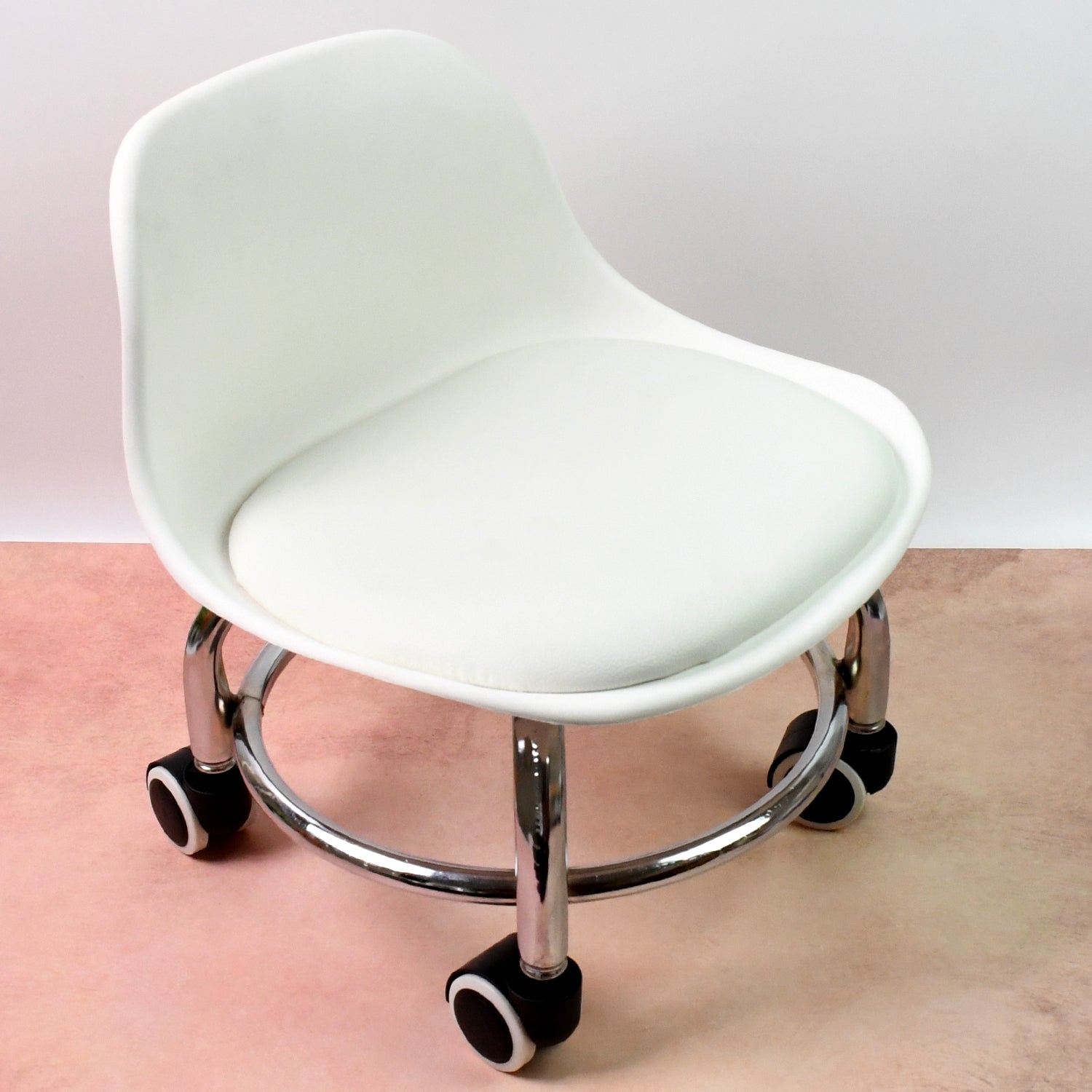 Close-up of the smooth 360-degree swivel wheels on the low roller seat for easy mobility.