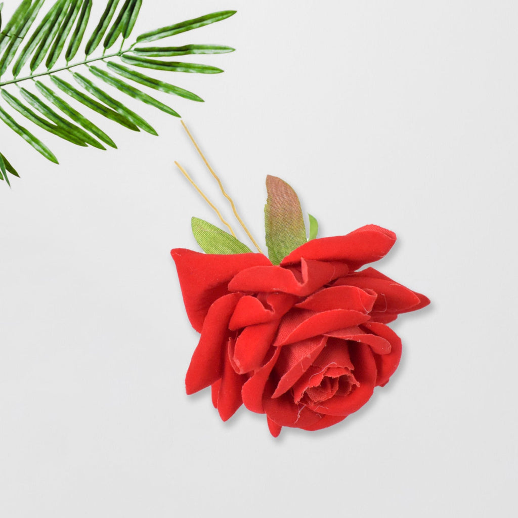 Detail shot of the durable metal clip and soft red rose flower.