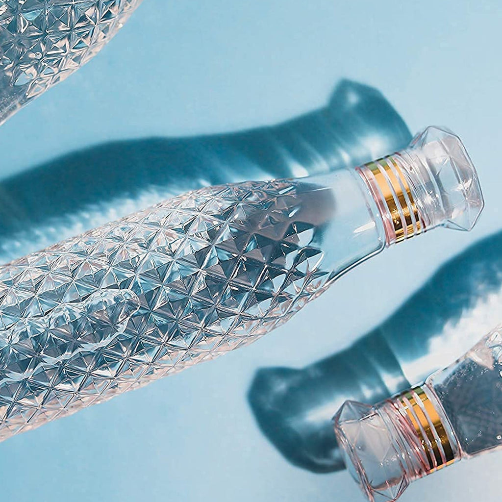 Three colorful children's water bottles with diamond cut design, ready for daily adventures.