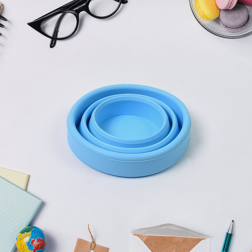 Silicone foldable travel mug without a lid, showcasing its interior and material texture.