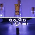A glowing wine bottle cork string light with multi-color LEDs, perfect for festive decor.