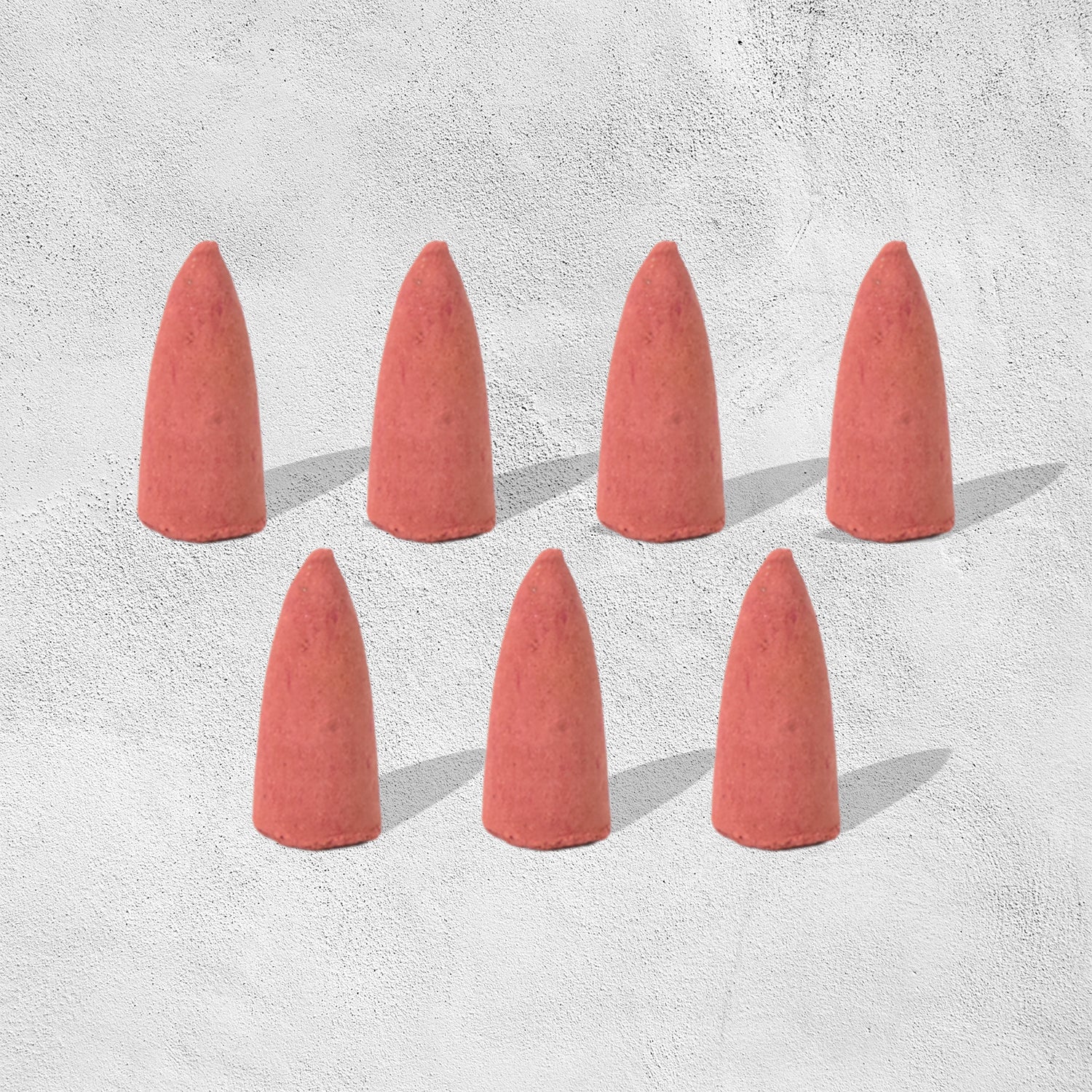 A pack of specialized backflow incense cones, essential for creating the smoke waterfall effect.