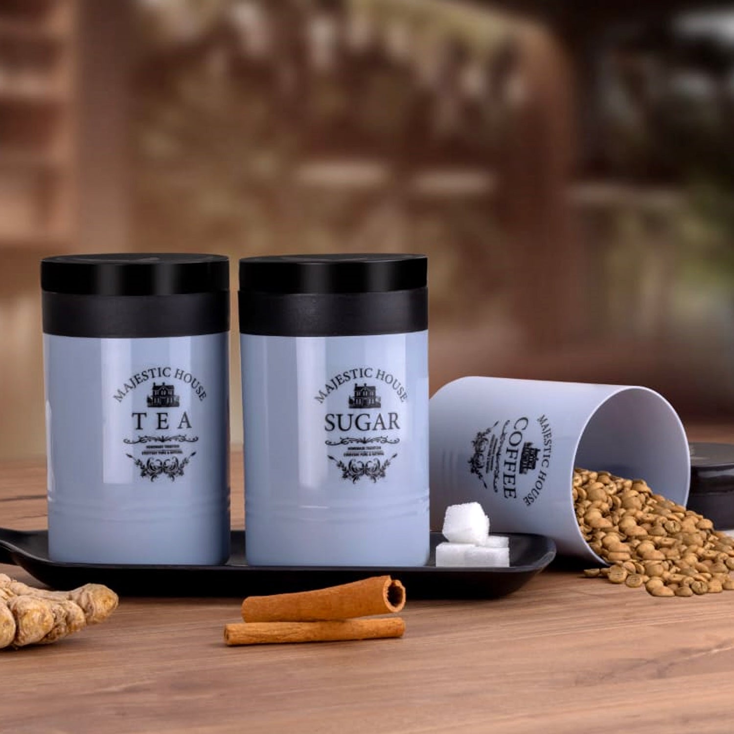 Three plastic damru-shaped airtight containers labeled 'Tea', 'Coffee', 'Sugar' on a white background.