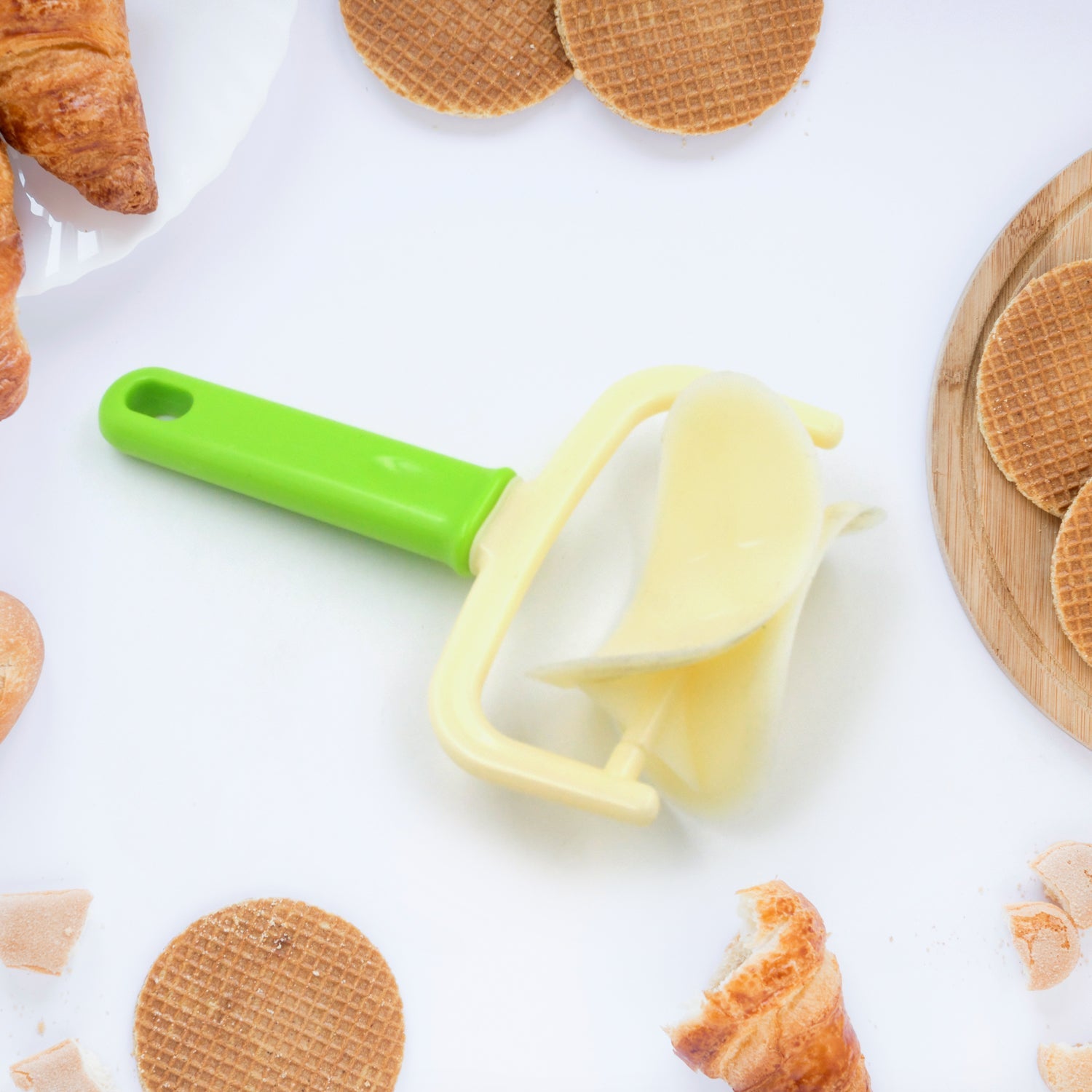 Close-up of the durable plastic dough cutter roller preparing pastry.