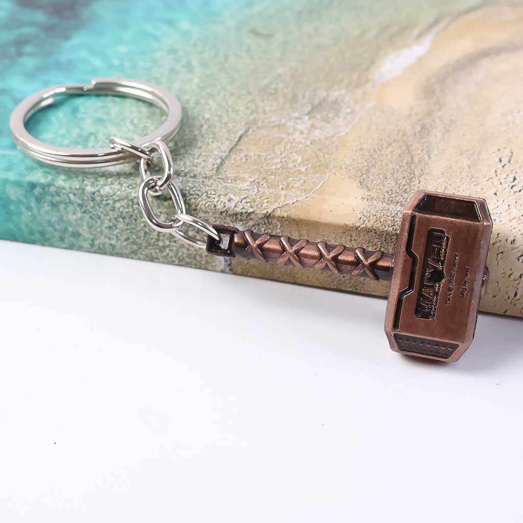 Metal hammer keychain securely holding multiple keys