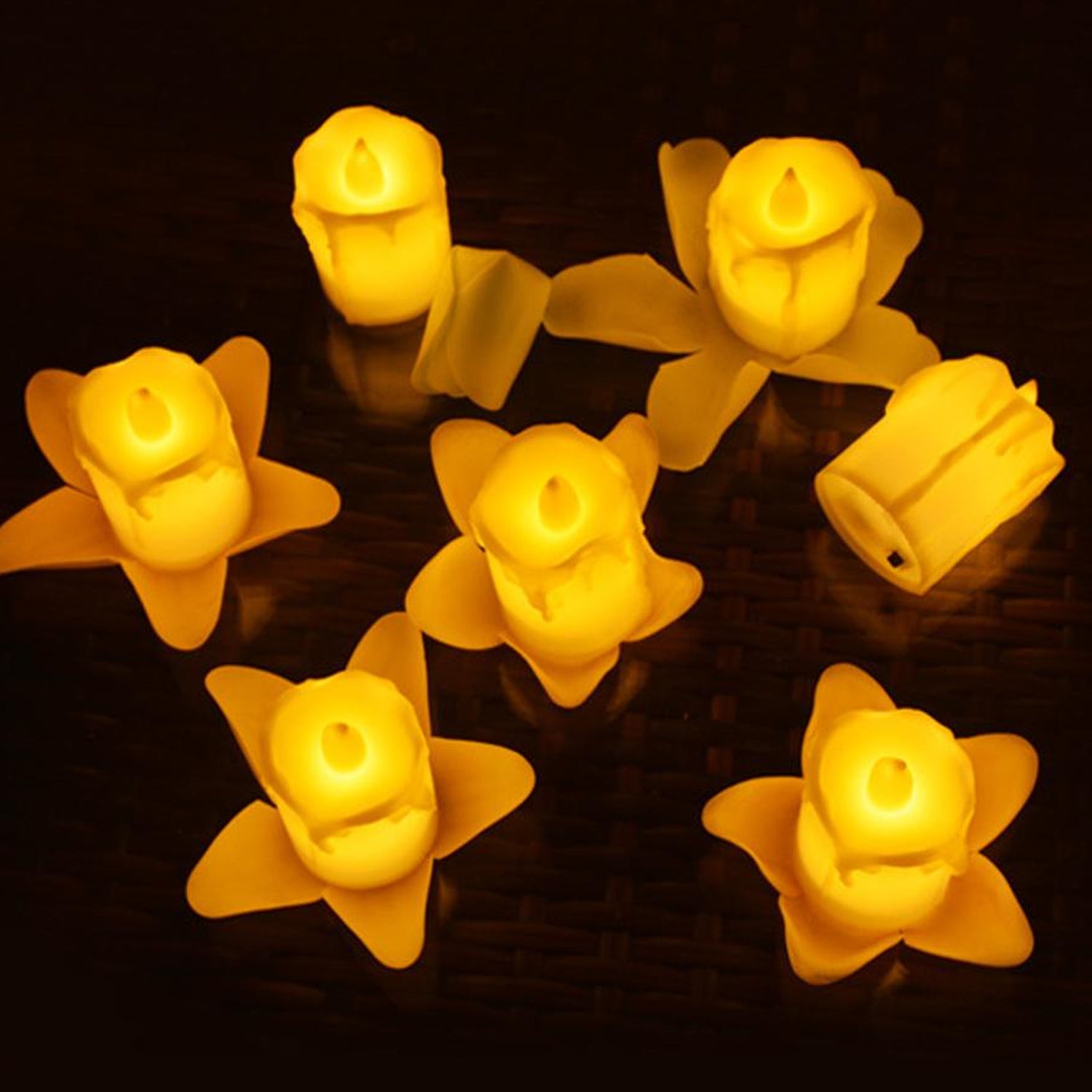 Multicolor flameless LED candles arranged decoratively, highlighting their vibrant hues.