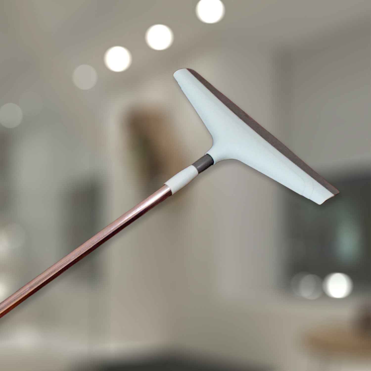 Detailed views of the Ganesh extendable floor wiper, highlighting its design.