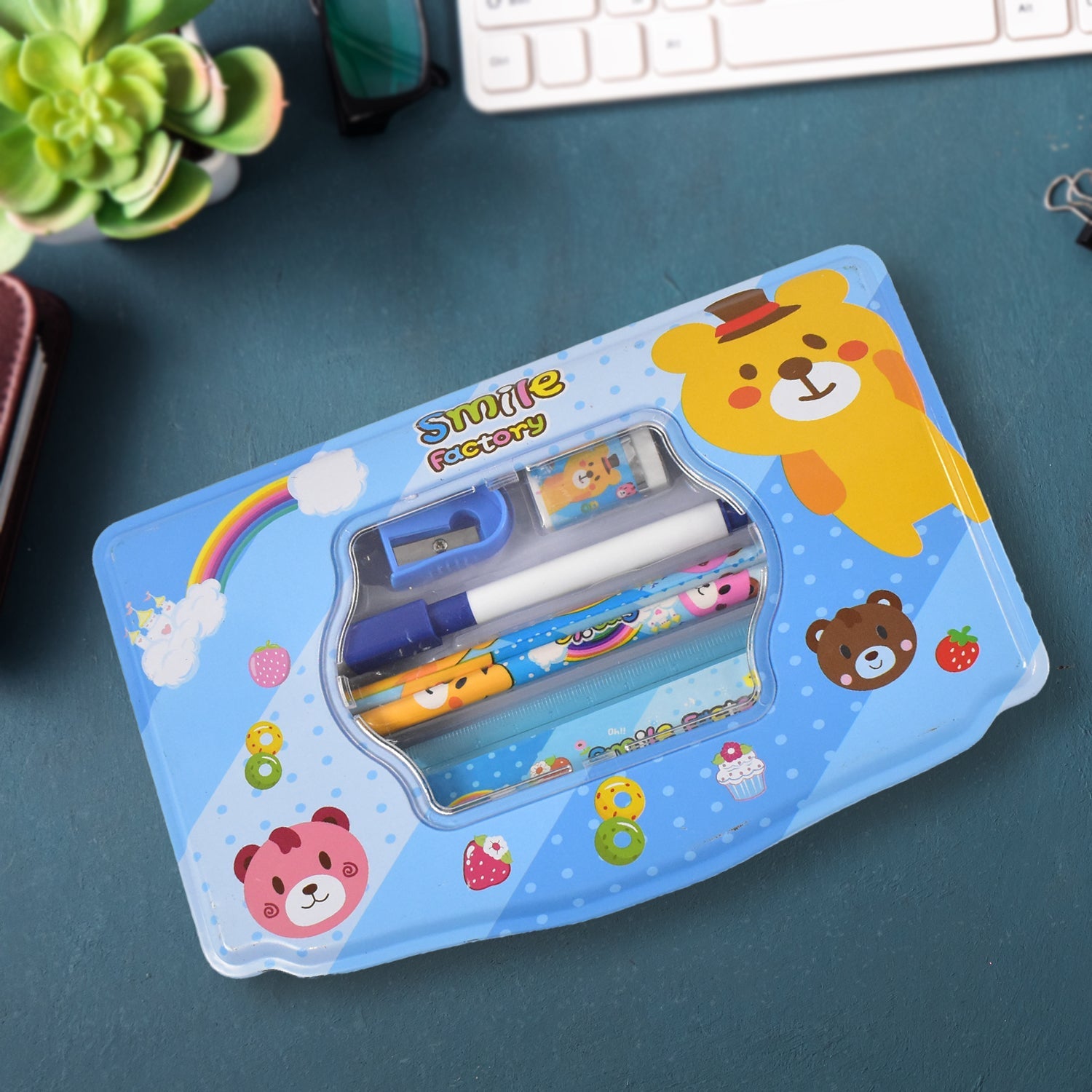 Vibrant cartoon metal compass box for kids, showcasing the included 6-piece stationery set.
