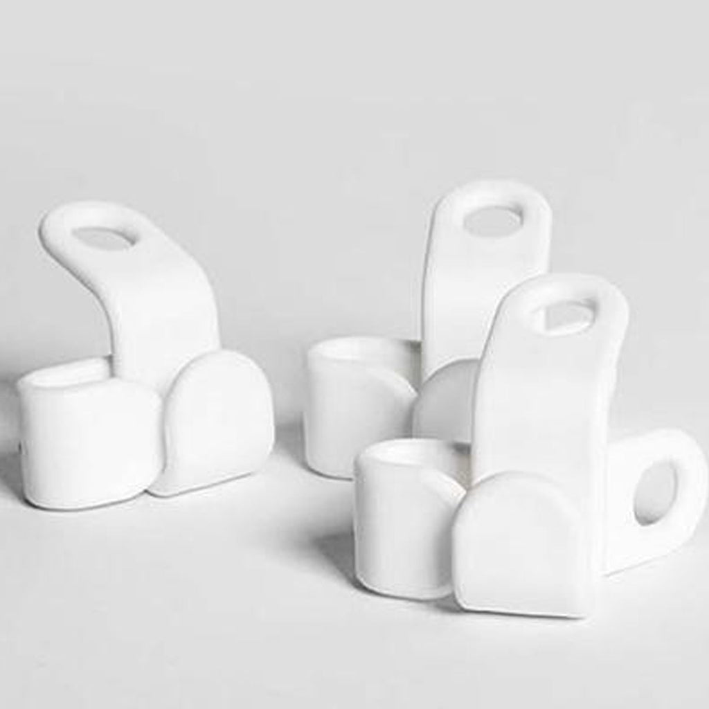 Organised display of white hanger connector hooks for closet management.