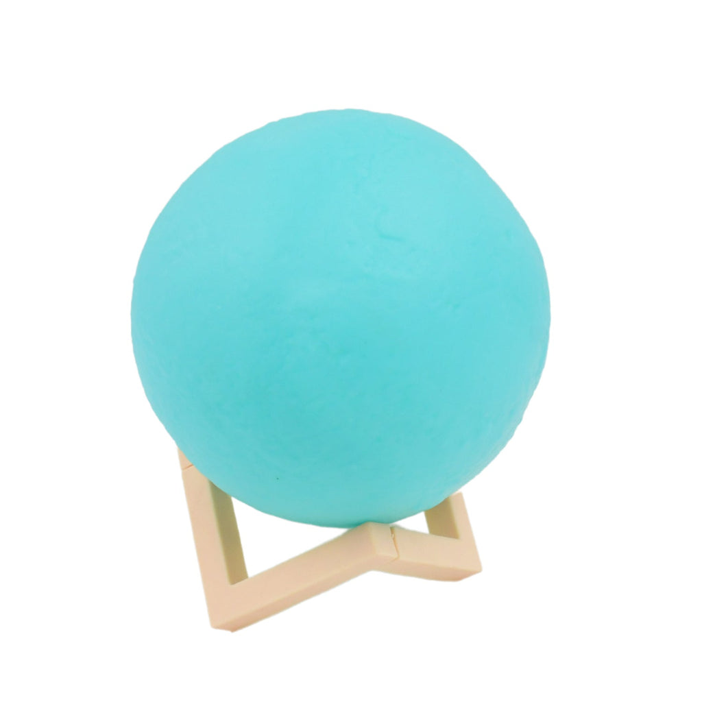 The Moon Night Lamp's durable plastic stand provides stable support for the spherical light.