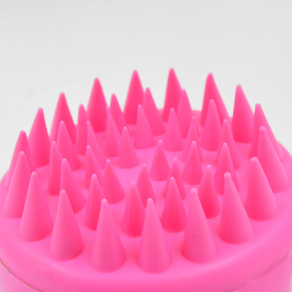 Scalp cleansing brush with ergonomic handle for deep hair wash.