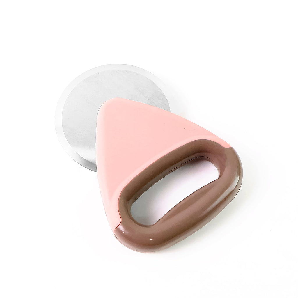 Compact ergonomic pizza cutter stored in kitchen drawer