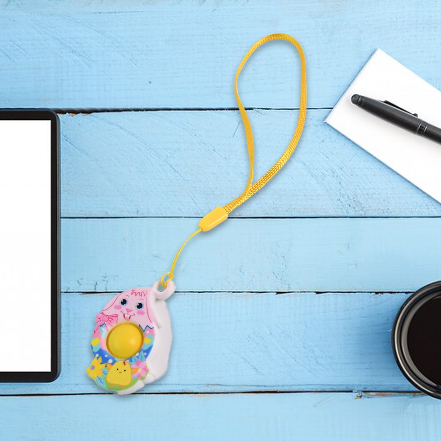 Tiny chick push pop fidget toy in bright colors for sensory stimulation