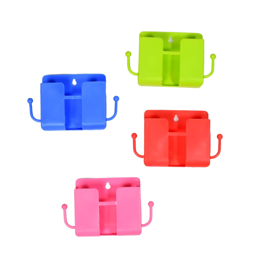 White wall mounted storage box with side hooks holding a remote and phone.