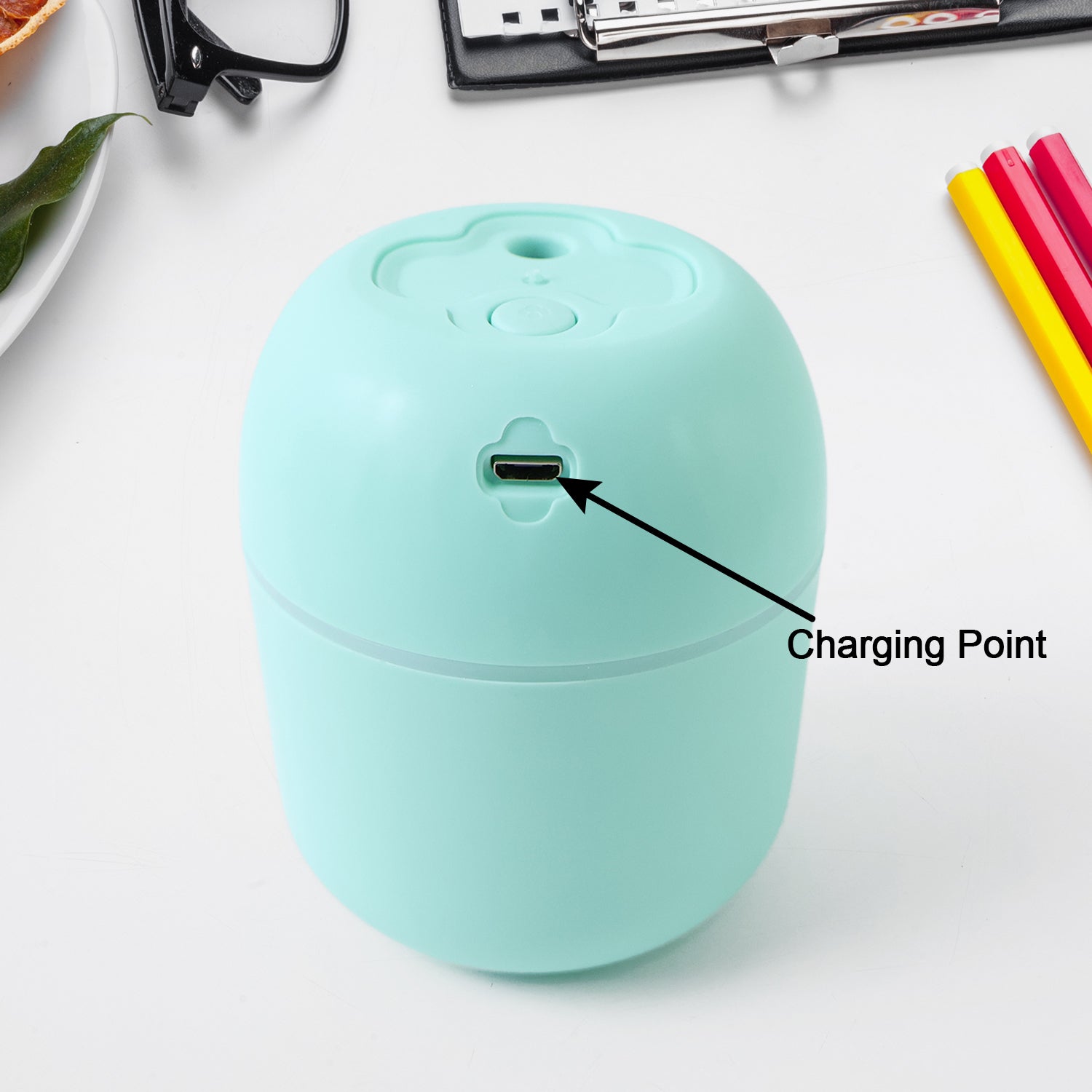 Mini USB Humidifier actively producing cool mist for improved air quality.