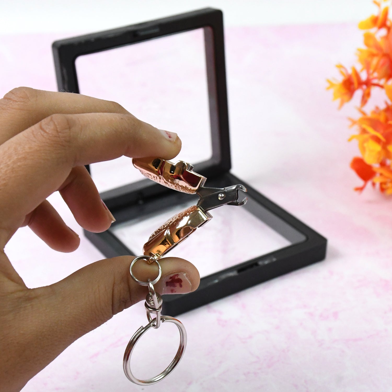 Compact nail clipper keychain with 3D floating frame display by AuriGlam