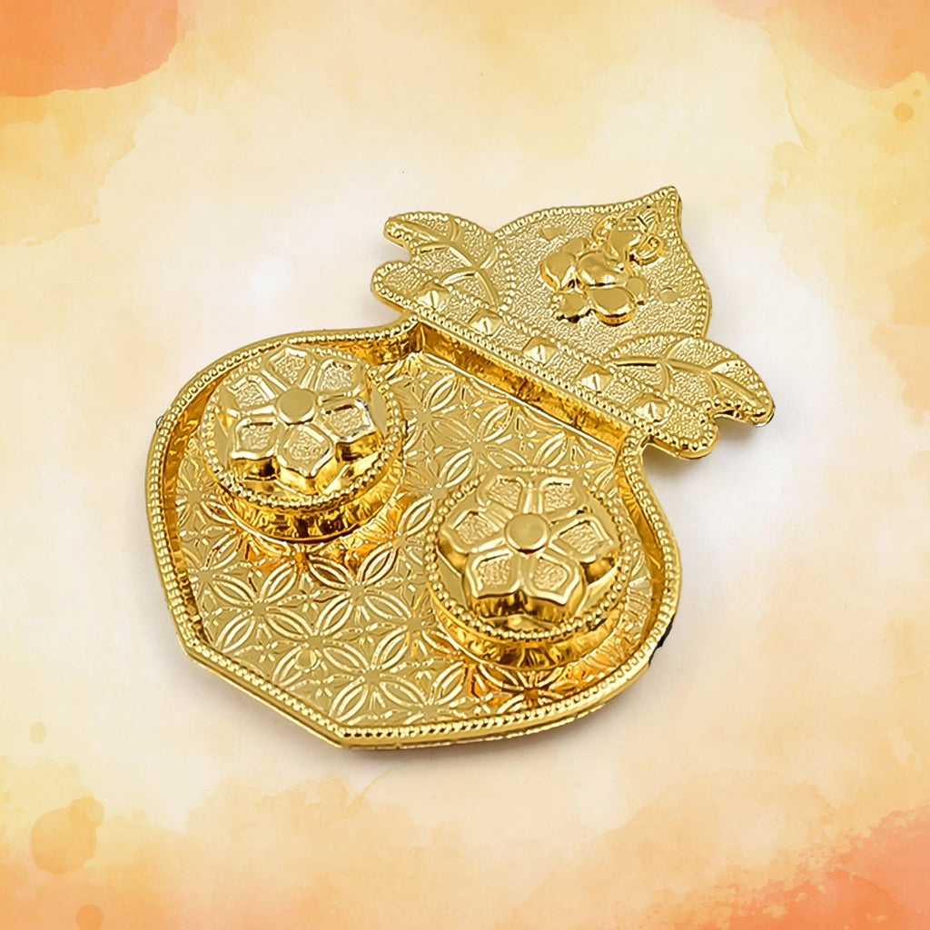 Detail of the integrated kumkum holders on the Raksha Bandhan thali.