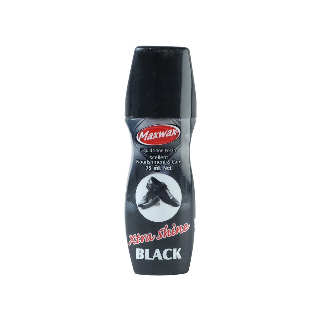 Close-up of liquid black shoe polish being applied to a shoe