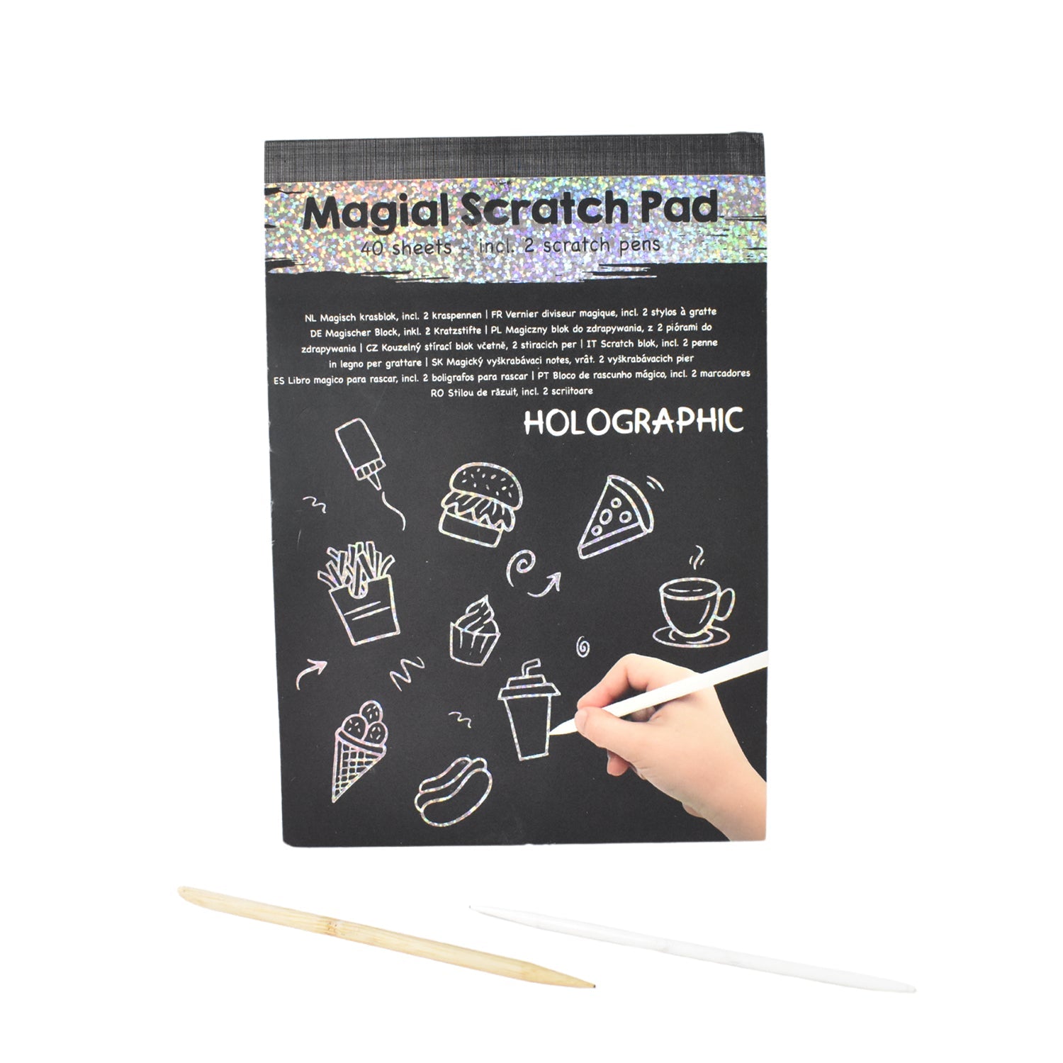 Child drawing detailed doodle on colorful scratch art sheet