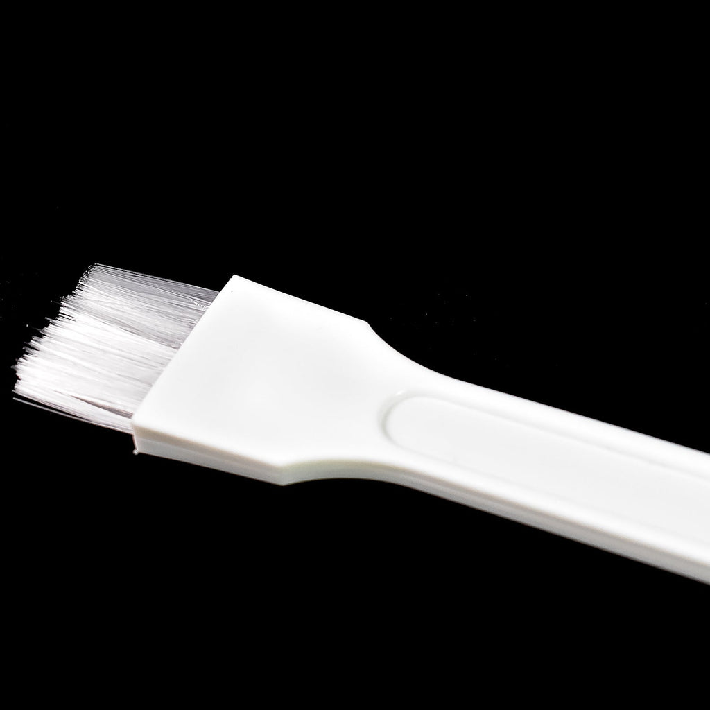 Kitchen cleaning brush reaching into narrow corners.