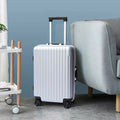 A vibrant multi-color trolley bag set displayed open, showcasing spacious interiors.