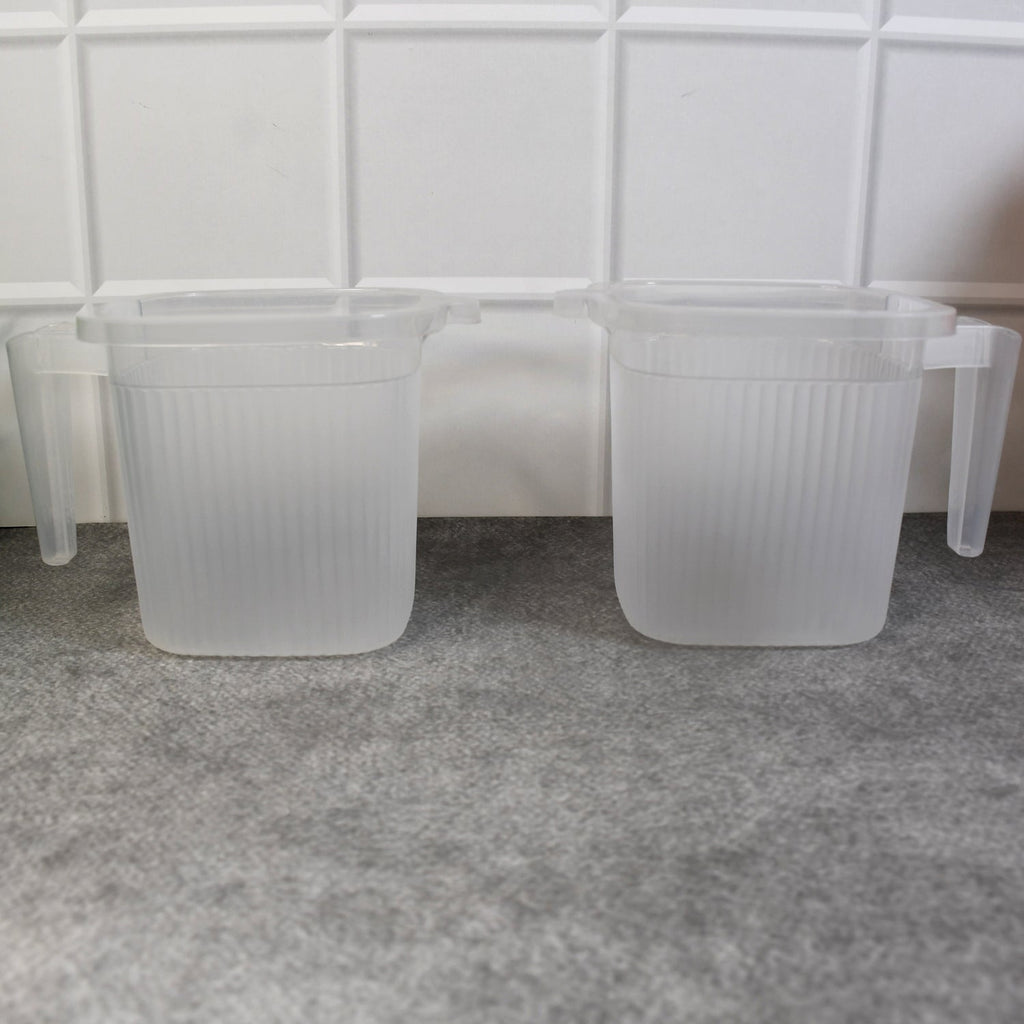 Overhead view of the robust plastic mugs, showcasing their wide opening for easy cleaning.