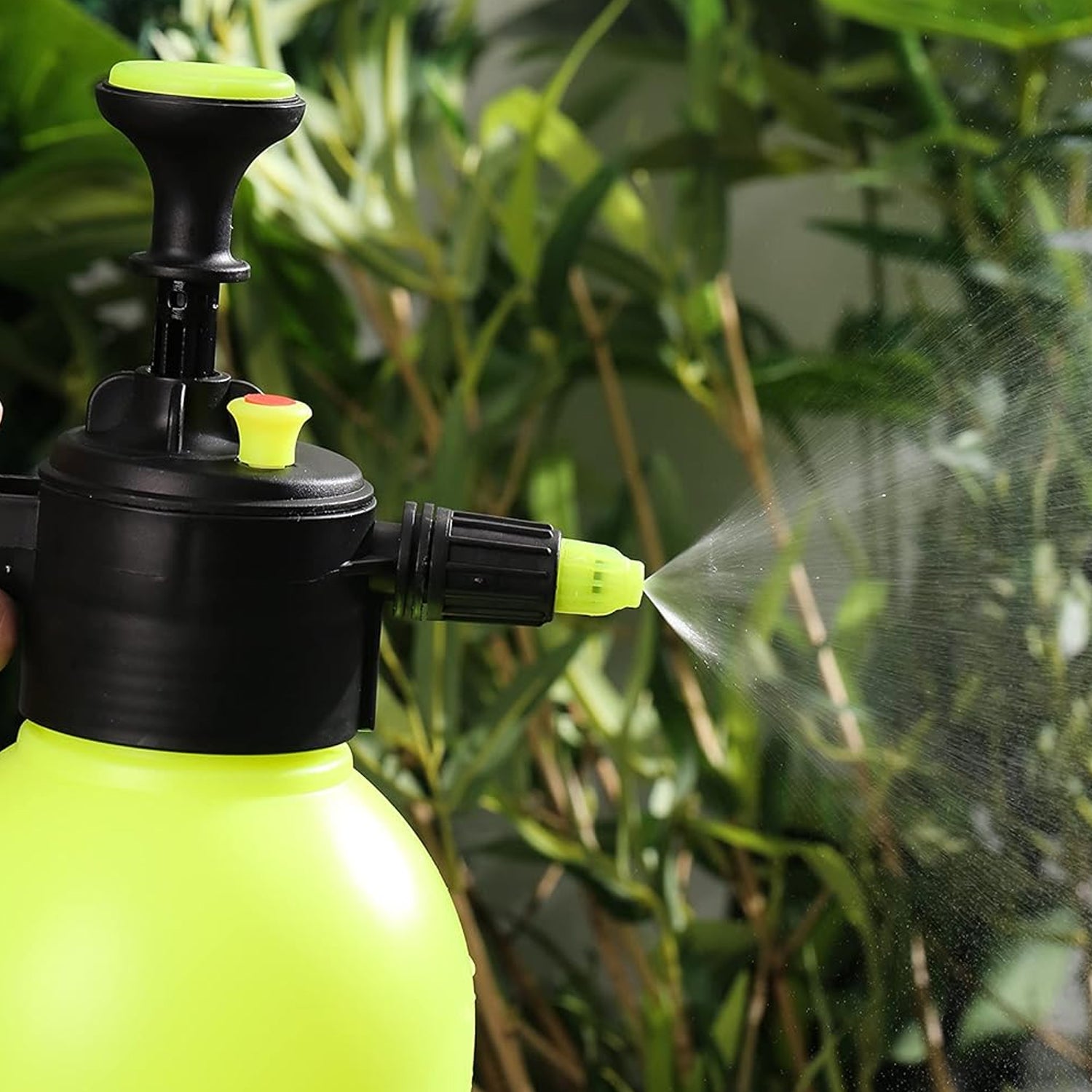 Watering can spray nozzle demonstrating a gentle, wide spray pattern.
