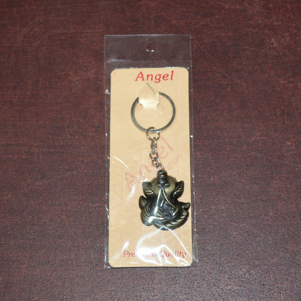 Ganesh Face Antique Black Metal Keychain placed on plain background for clear visibility