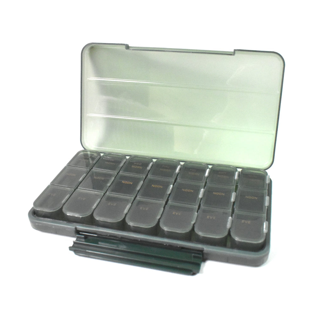 Empty 21-grid pill organiser on a clean surface, ready for medication loading.