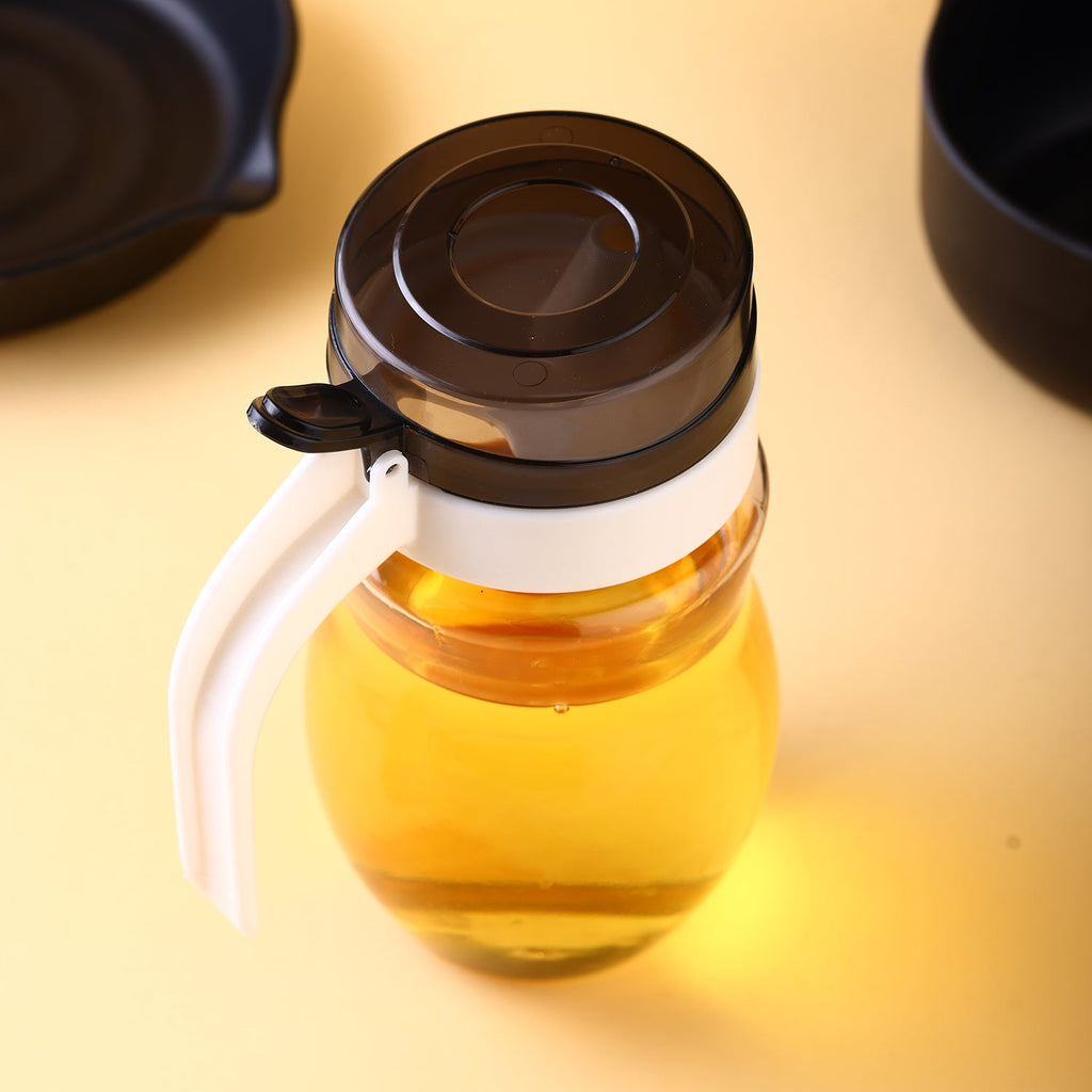 650ml plastic oil dispenser with sleek design for kitchen use.