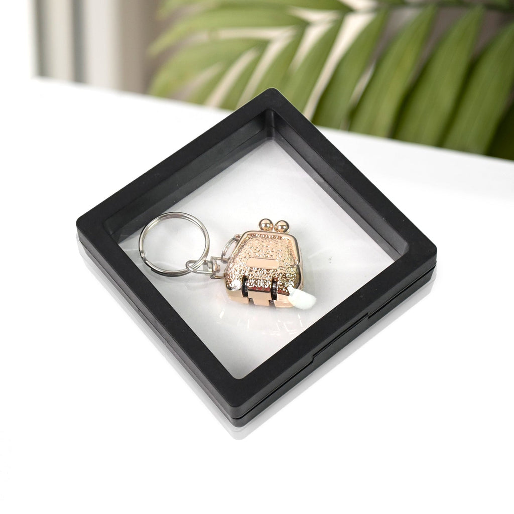 Nail clipper with unique floating keychain frame for easy portability