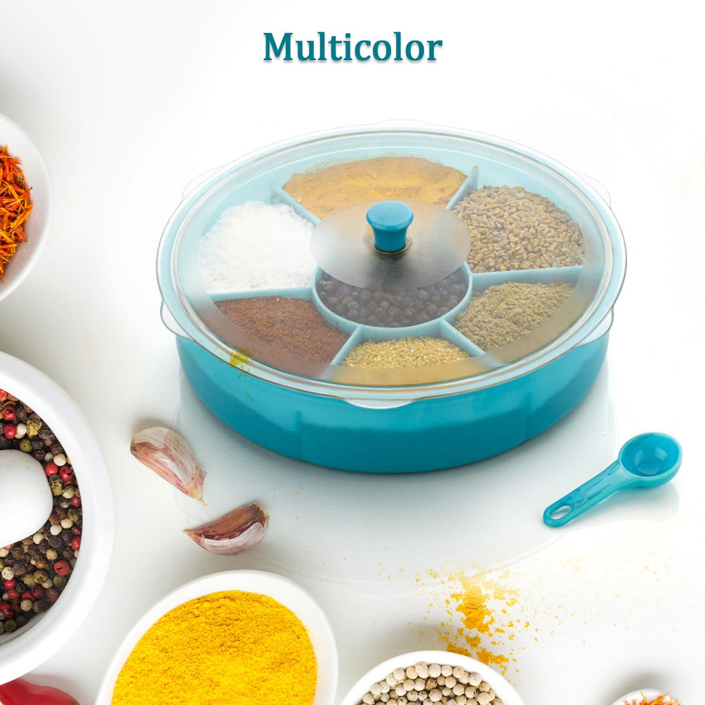 The 7-section Dry Fruit & Masala Box with a spoon, ready for use in any Indian kitchen.