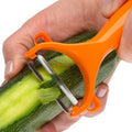 Close-up of a Y-shape vegetable peeler with a sharp stainless steel blade.