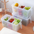 Transparent refrigerator organizer box with three compartments.