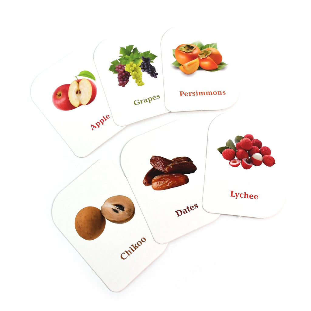 Array of laminated fruit flashcards displaying colorful fruit pictures