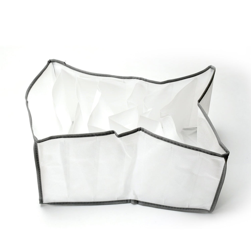 Organivo 7 Grid Clothes Organizer perfectly placed in a wardrobe drawer with jeans.