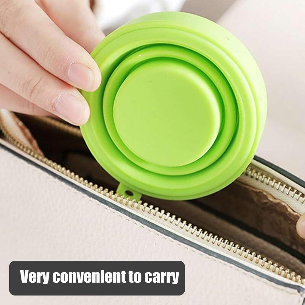 Flexible silicone foldable travel mug demonstrating its durable material.