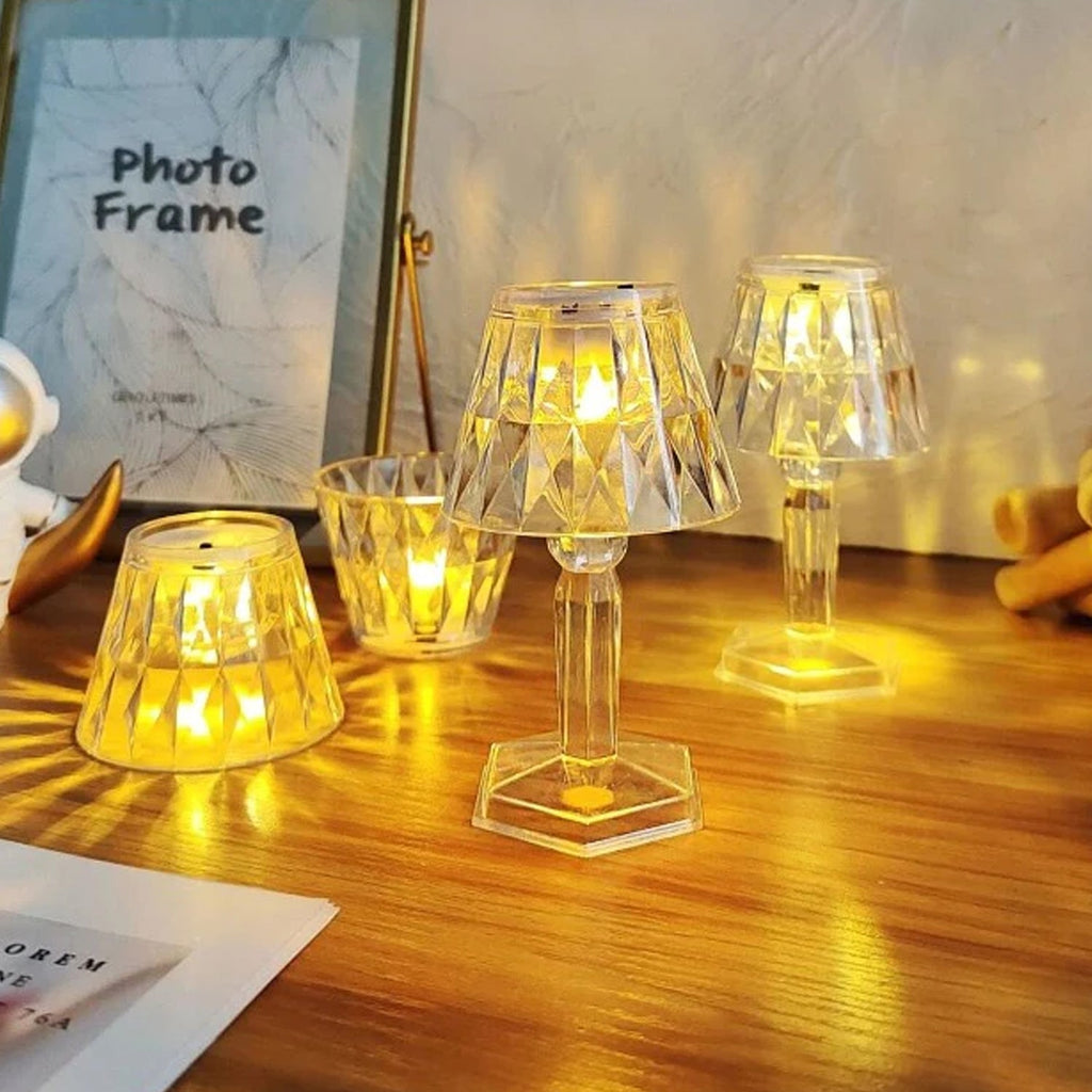 The elegant 2-in-1 crystal table lamp placed on a bedside table.