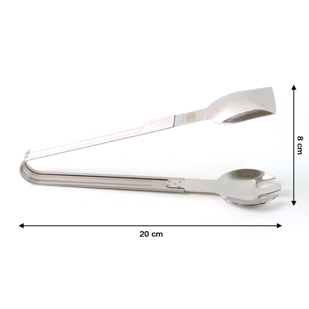 Salad being served with stainless steel multipurpose serving tong