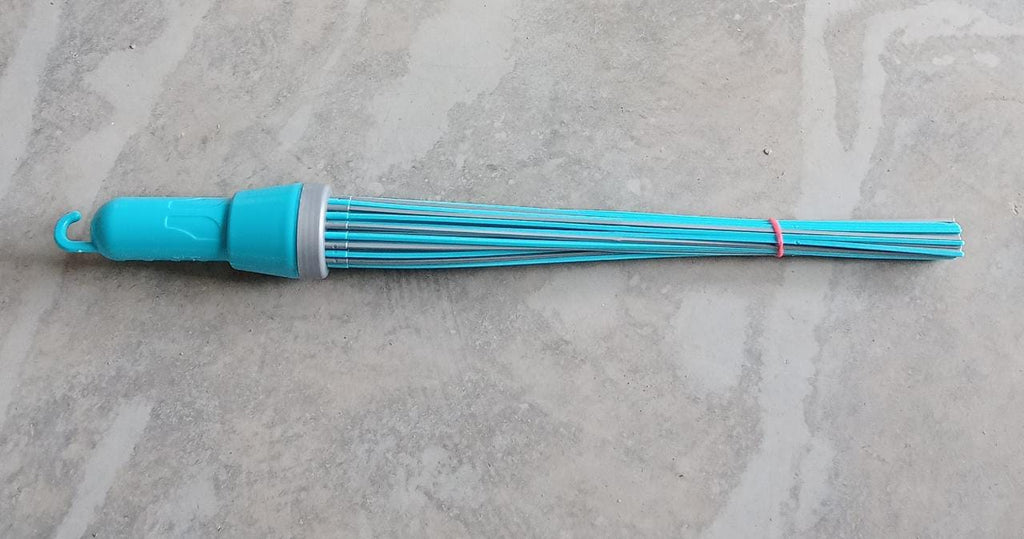 Plastic broom for effective cleaning, highlighting its stiff bristles and base.