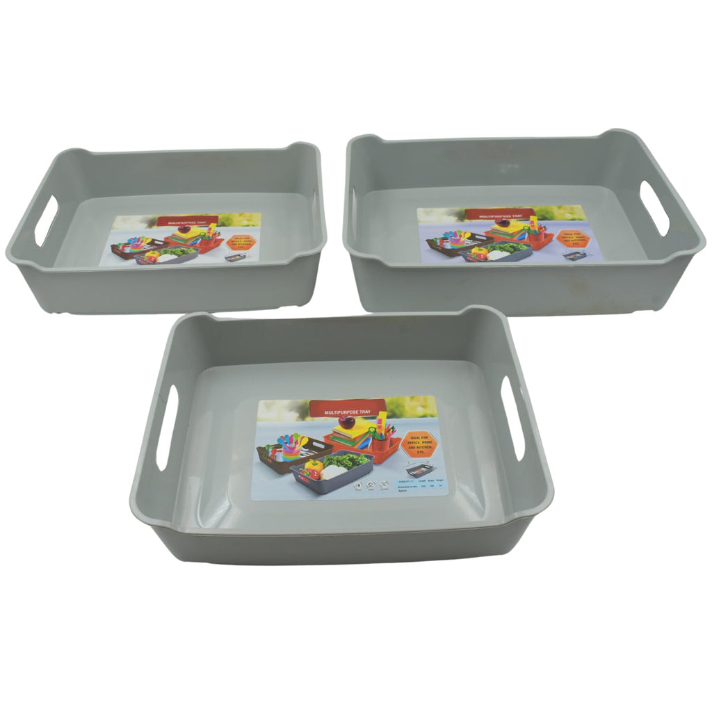 Compact plastic trays used for organizing cosmetics and stationery on a desk