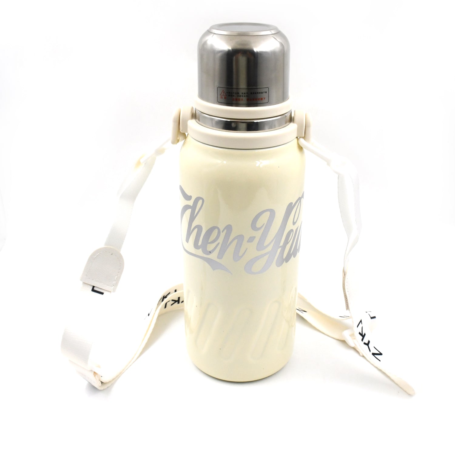 The 1200ML hot and cold water bottle being carried comfortably by its handle.