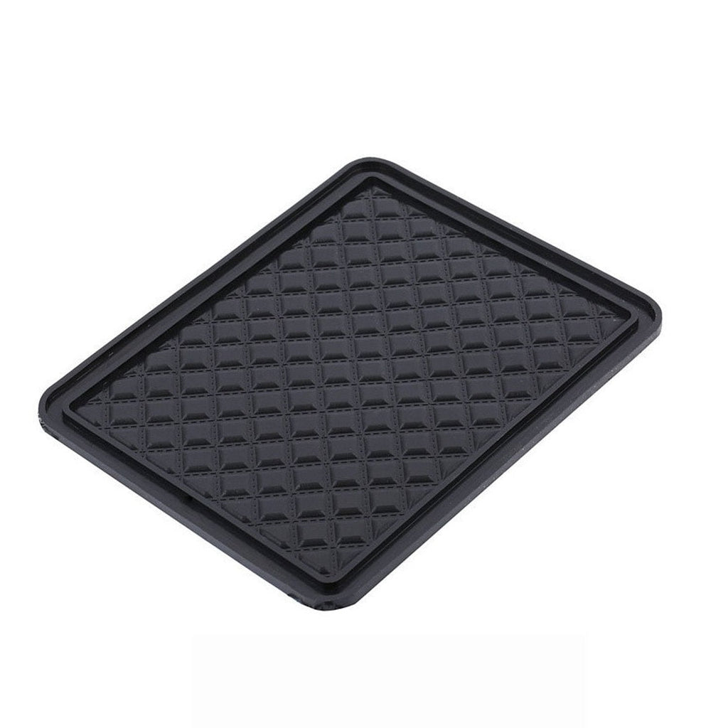 Universal anti-skid mat preventing items from sliding on a smooth table surface.